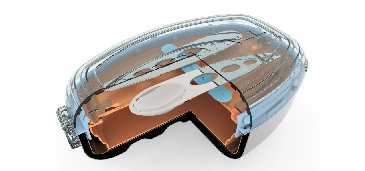 Cutaway showing the insulated body, food shuttle, lid, and component arrangement.