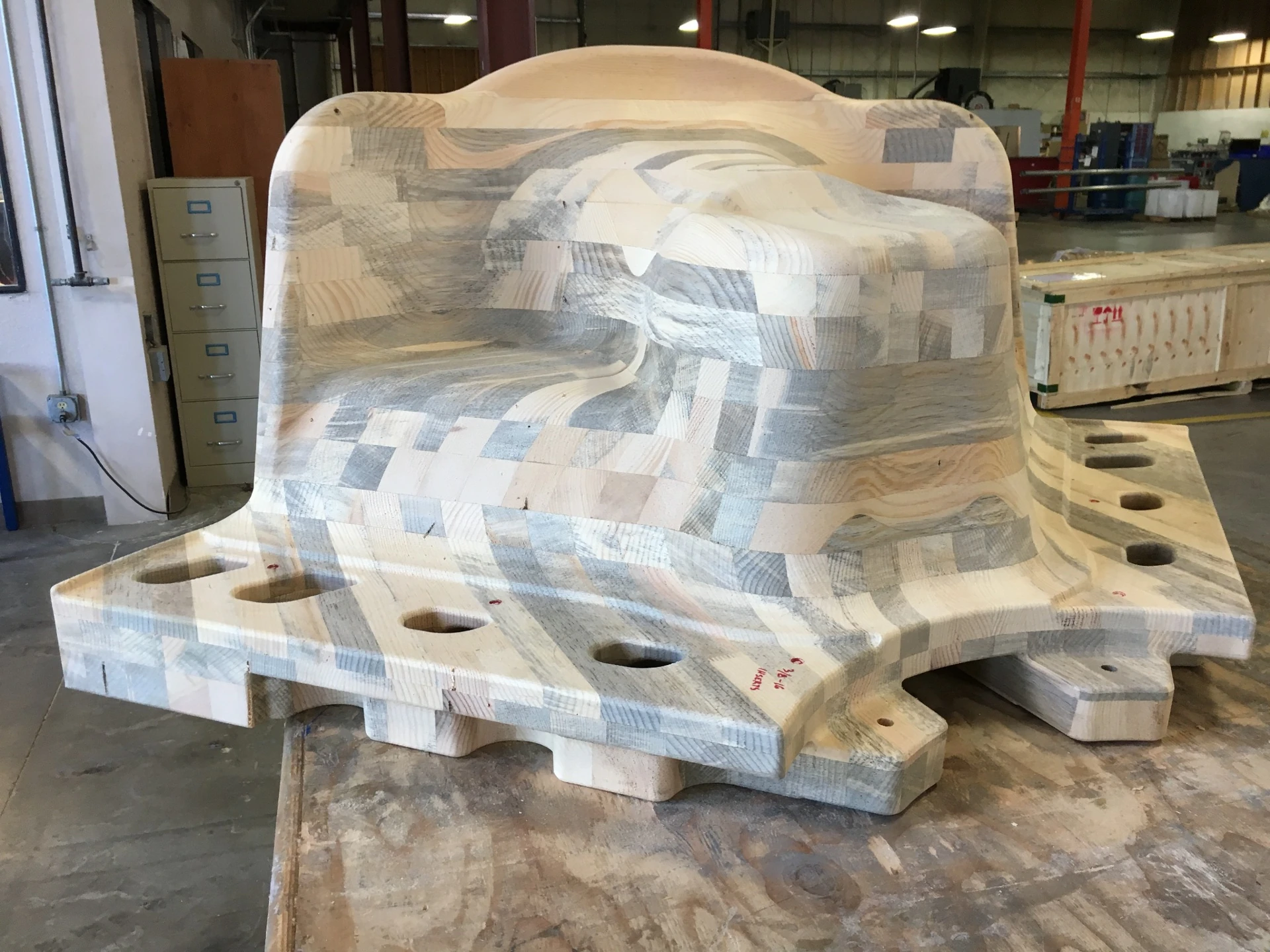 1:1 CNC-machined wood prototype before painting — seat depth and backrest